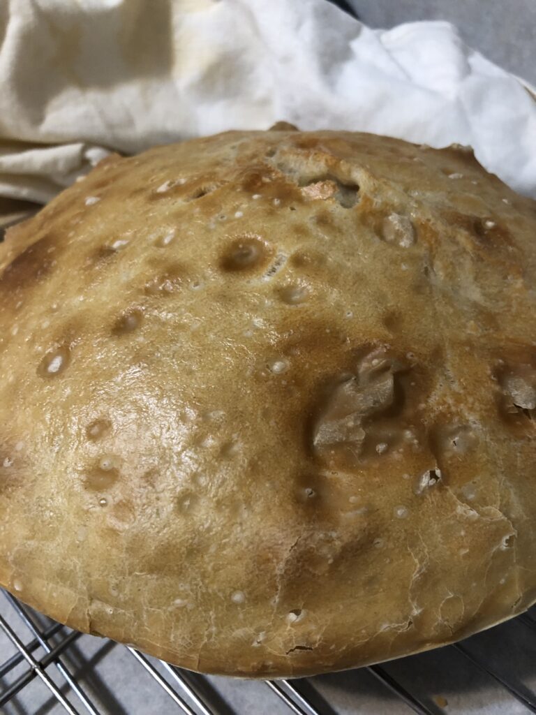 This loaf is made by letting the dough sit for 12-24 hours of proofing, and baking in a preheated casserole.